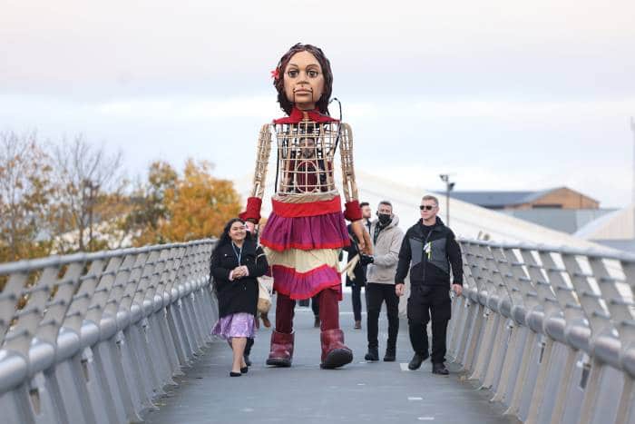 Little Amal and Pacific Climate Warrior Brianna Fruean approach COP26 in Glasgow.