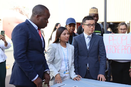 Masayoshi of 350 Japan and other delegates at a civil society event at COP27